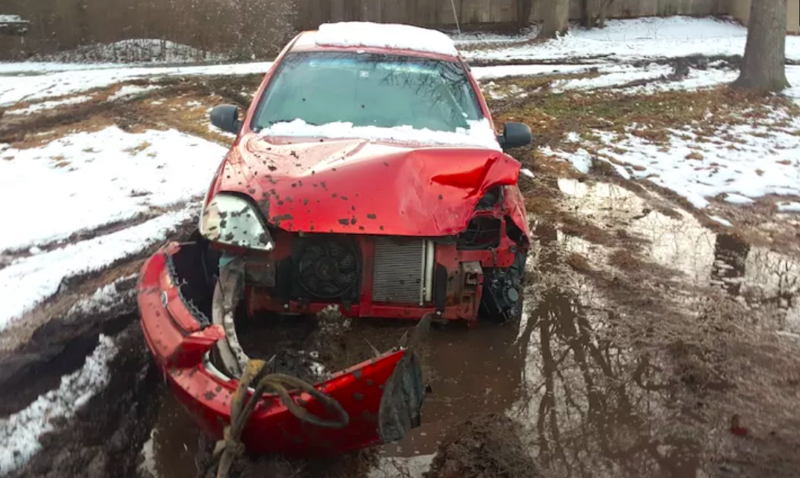 My Kia no longer sits in a mud pit, but it is still immobile and in my backyard.